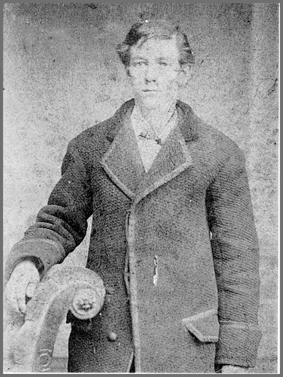 Studio portrait of a young man in a heavy overcoat, accompanying the Shelby County sketch of James Wharton Stevens